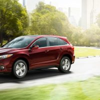 2013-rdx-exterior-with-technology-package-in-basque-red-pearl-ii-park-and-buildings-10