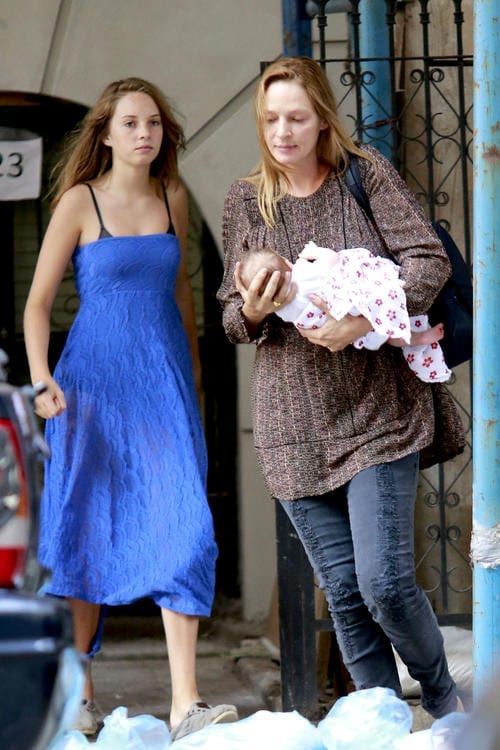 A makeup-free Uma Thurman takes her newborn baby daughter to the doctor's office in NYC